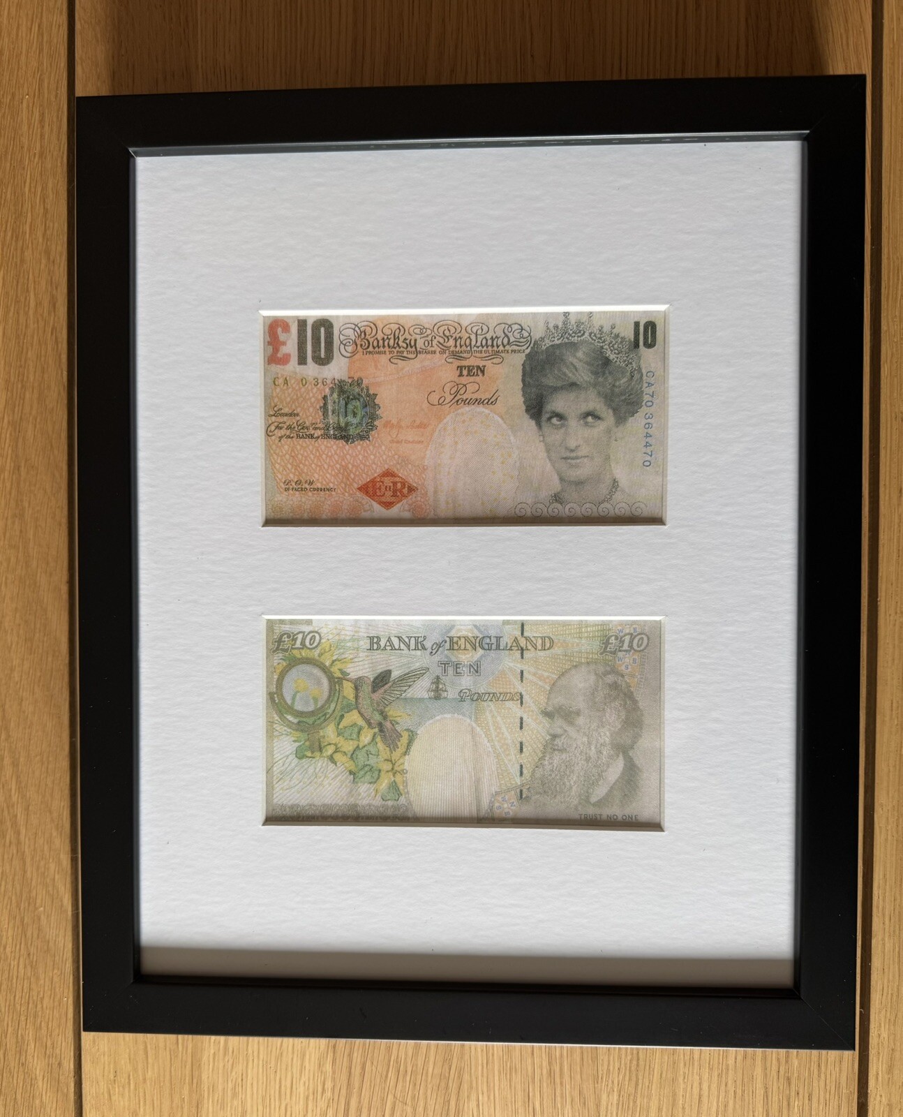 Banksy Di Tenner Two Notes Mounted In Black frame striking