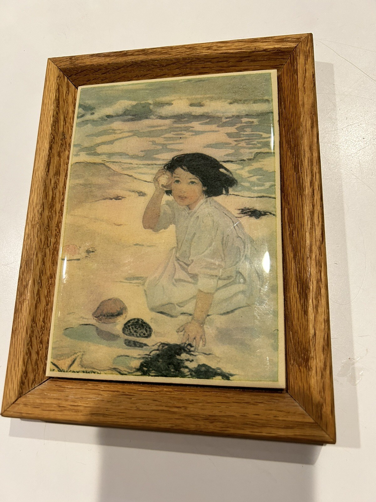 The Senses Of Hearing On Ceramic Tile Sea Shells By Jessie Willcox Smith Framed