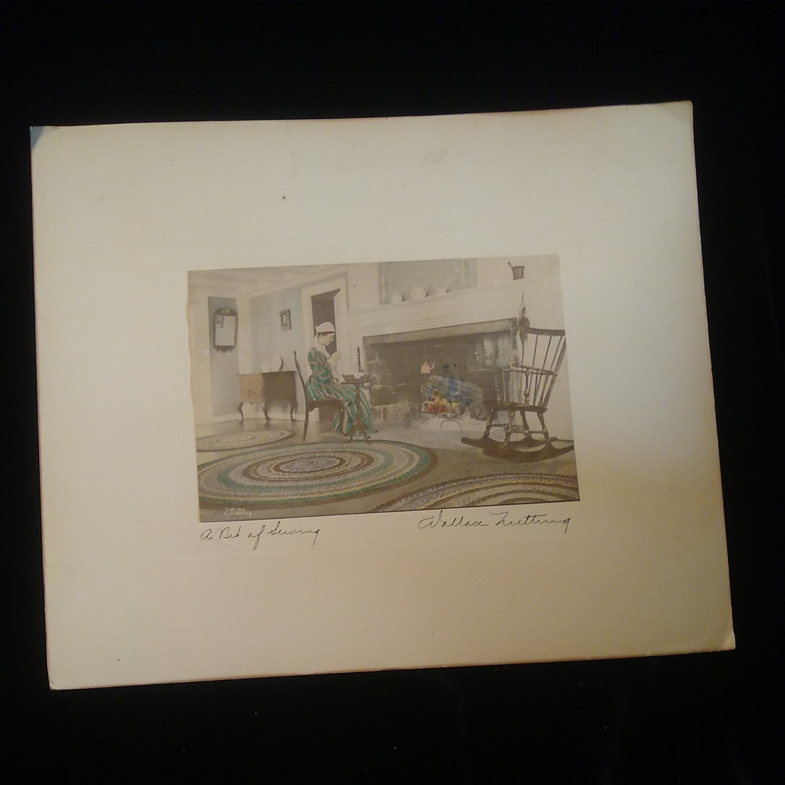 Wallace Nutting Signed 1913 Hand-tinted print – Woman By Fireplace